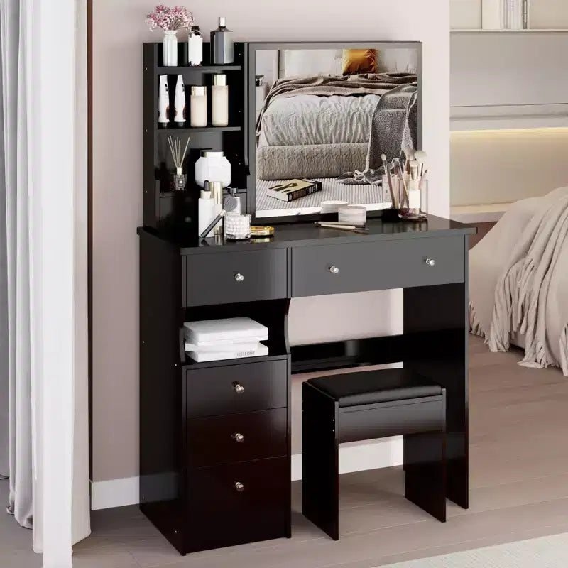 Compact vanity table features a left drawer, a cushioned stool, a large sliding mirror on the right side, and multiple storage compartments